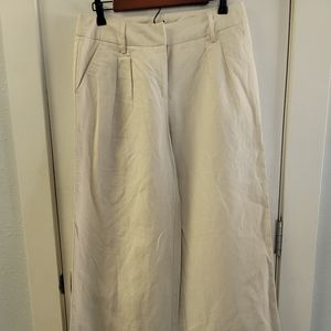Cream colored wide-leg (12") linen pants.